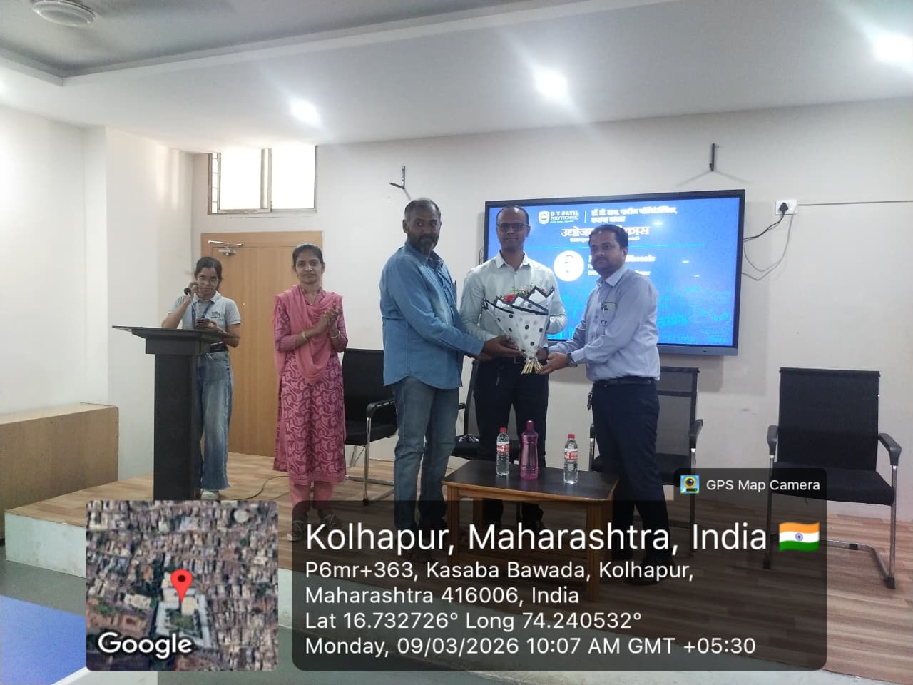 DNG team receiving a bouquet as a token of gratitude